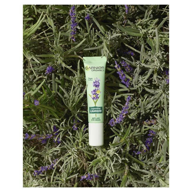 Garnier Organics Lavandin Anti-Age Eye Cream product laying in lavandin